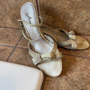 Strappy silver sandals with rhinestone accents